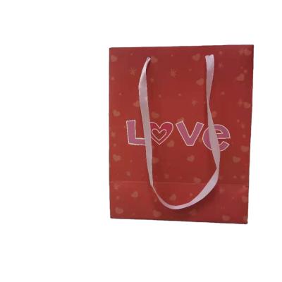 China Recyclable Low Price Ribbon Handle Gift Wrapping Bag Wedding Gift Wrapping Bag for sale