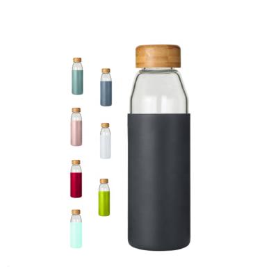 China 2017 Sustainable Bamboo Lid 500ml High Borosilicate Glass Water Bottle With Silicone Sleeve for sale