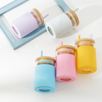 China Sustainable Biodegradable Cute Baby Water Drink Glass Bottle Silicone Sleeve Tumbler Kids Cup for sale