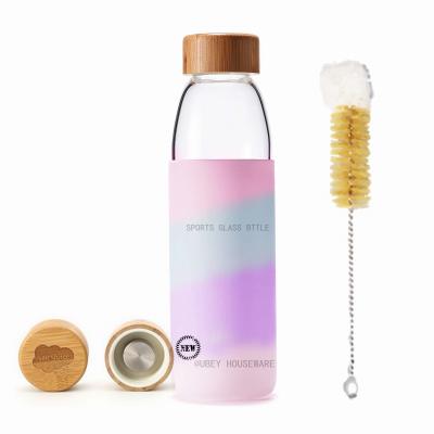 China Sustainable Private Label Sports Custom Silicone Sleeve Glass Water Bottle With Bamboo Lid for sale