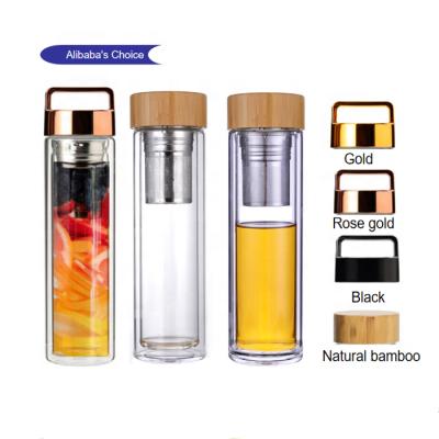 China 2021 Sustainable Hot Selling Double Wall Amazon Fruit Tea Infuser Glass Water Bottle With Metal Pink Cap Gold Bamboo Lid for sale