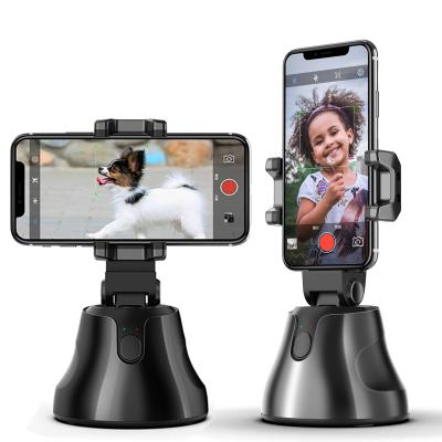 China 2021 Hot Adjustable In Amazon Smart Shooting Automatic Face AI 360 Rotation Object Tracking Cell Phone Holder for sale