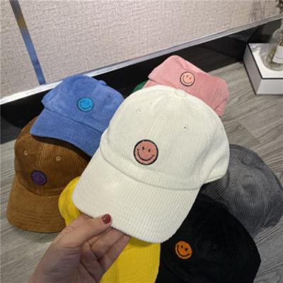 China New Winter Good Quality Fashionable Common Stock Women's Warm Knitted Hat Candy Colors Cute Smiley Face Wool Hat Beanie Hats For Men for sale