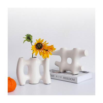 China Minimalist Matte White Irregular Shape Ceramic Vase Porcelain Fence Abstract Irregular Flower Vase for sale