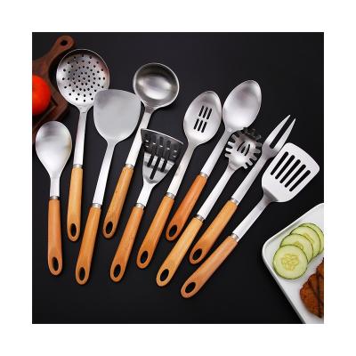 China 10PCS Sustainable Stainless Steel Utensils Non-Slip Heat Resistant Kitchen Cooking Tool With Wooden Handle for sale