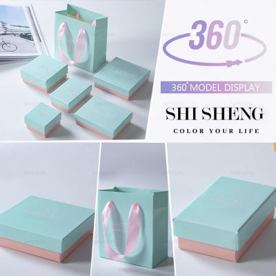 China Morden SHI SHENG Wholesale Luxury Blue Cardboard Jewelry Boxes and Packaging Paper Bag with Cotton for Gift for sale