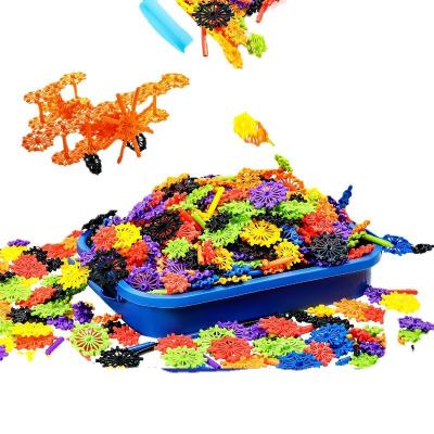 China Construction Toy Snowflake Building Block Toys Set Creative Assembly Toys Wholesale Children's Diy Aircraft Wheel Piece Plastic Toys for sale