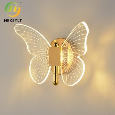 China Luxury Butterfly Modern Wall Lamp Hotel Bed And Bedroom TV Wall LED Three Color Light for sale