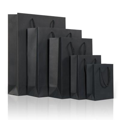 China Handmade Wholesale Cheap Paper Kraft Bag Black Package Paper Bag With Handle for sale