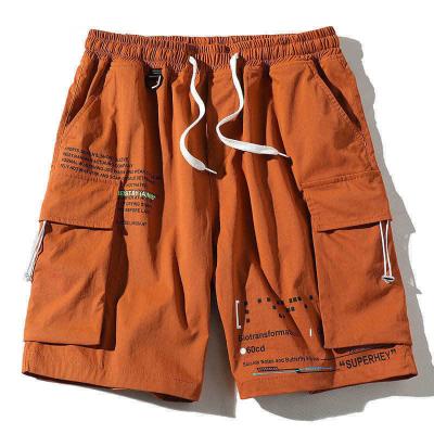 China Anti-wrinkle Summer High Street Cargo Shorts Drawstring Pocket Custom Letter Printed Short Pants Male for sale