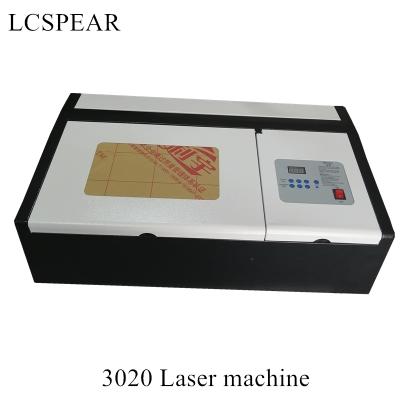 China laser engraving 3020 laser engraving machine with 40w laser tube with honeycomb table have good price for sale