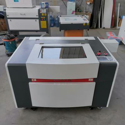 China High quality reci 100w CO2 laser machine 4060 water cooled laser cutting machine for acrylic and fabric leather wood for sale