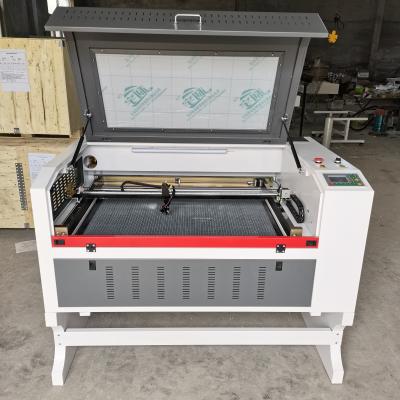 China RECI W2 100W 6090 Water Cooled CO2 Laser Cutting Machine with Ruida 6445 Control Panel and CW5200 Water Cooler and Rotary Tools for sale