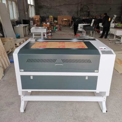 China RECI 100W m2 6090 laser engraving or CO2 9060 laser cutting machine with 600*900mm across working table have good price for sale