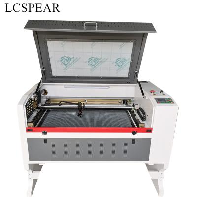 China RUIDA 6445 6090 or 9060 laser engraving cutting machine have 60w 80w and 100W with CW5200 water chiller free to your sea port for sale