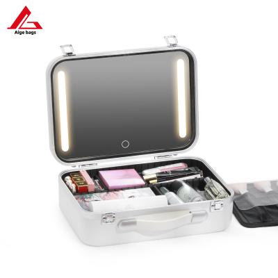 China Fashion Lighted Mirror Professional Cosmetics Makeup Train Organizer Pink Vanity Boxes Cosmetic Case For Makeup With LED Lights for sale