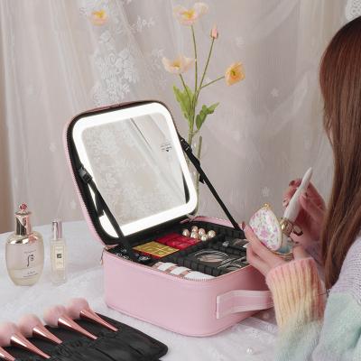 China Fashion Custom Logo Travel Makeup Organizer Multifunctional Pink Make Up Storage Bag With Led Light Mirror for sale