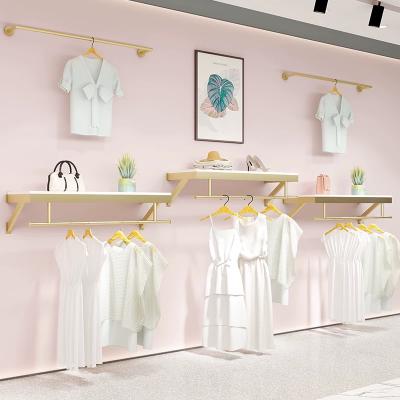 China For Clothing Store Gold Wall Clothing Rack Rack/Wall Clothing Display/Wall Mounted Clothing Rack for sale