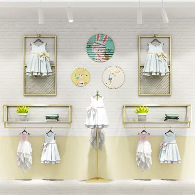 China For Clothing Store Gold Clothing Rack Wall Moumt Wall Mounted Clothing Store Wall Racks For Boutique for sale