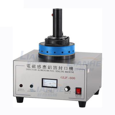 China Semi Automatic Food Electromagnetic Induction Sealer Aluminum Foil Sealing Machine for sale