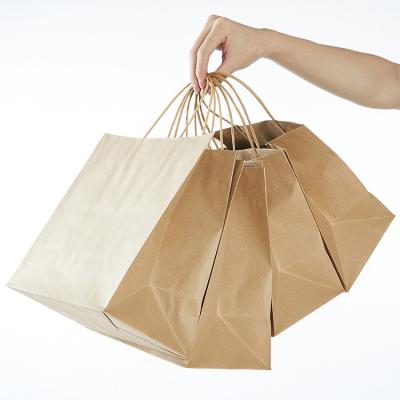 China Recyclable Custom Printed Luxury Large Handle Kraft Paper Shopping Packaging Gift Paper Bags for sale