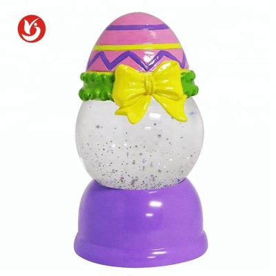 China 2020 Decoration Gift Artificial Snow Globe Water Battery Box Operation Easter Egg for sale