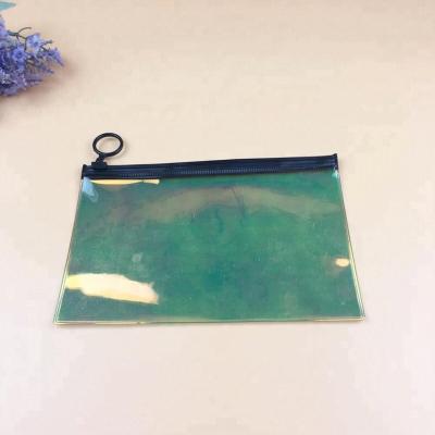 China Hot Selling Colorful Plastic Cosmetic Holographic Holographic Packaging Bag Waterproof PVC Zipper Holographic Bag for sale