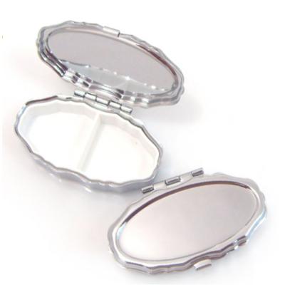 China New Small Metal Pill Case Box 2 Grids Oval Pill Box 2022 Iron Mini Stainless Travel Medicine Case for sale