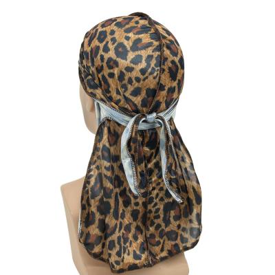 China Pirate Friendly Hip Hop Leopard Print Skin Satin Turban Hat Elastic Designer Durags for sale