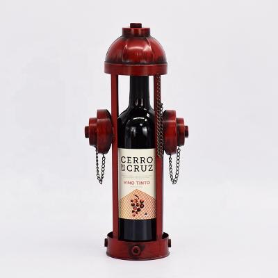 China Traditional Wine Bottle Holder Metal Fire Hydrant Shape Wine Rack for Desktop Decoration for sale