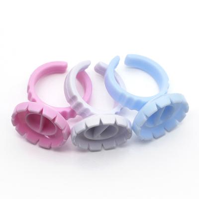 China Disposable blue /pink/white disposable glue cups glue rings for eyelash extensions glue holder with separator for sale