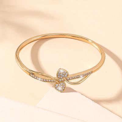 China Microset Other Heart Twisted Bangle Women Gold Plated Bangle Bracelet for sale