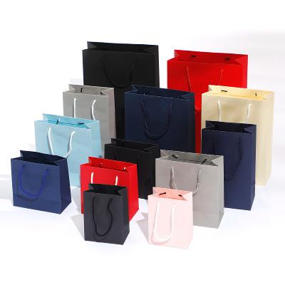 China Recyclable Wholesale Custom Portable Colorful Paper Kraft  Packaging Shopping Bags for sale