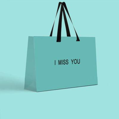 China Recyclable Wholesale Custom Portable Luxury Paper Kraft Gift Bags Packaging Shopping Bags for sale