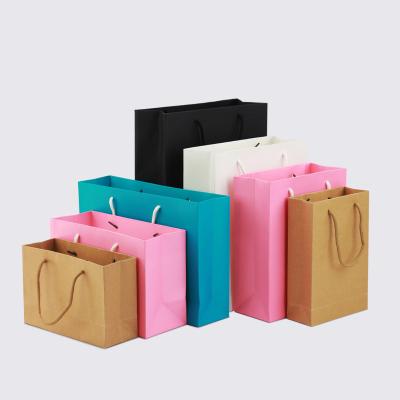 China Recyclable Wholesale Custom Portable  Paper Kraft  Packaging Shopping Bags for sale