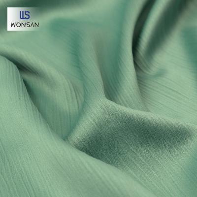 China Breathable High Quality China Garment 100%Polyester Fashion Shirts Blouse Fabric Plain Dyed Matt Satin Crepe Woven Fabric for sale