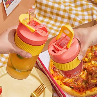 China Sustainable Borosilicate Glass Coffee Mug Tumbler Drinking Water Bottle With Lid And Straw Silicone Sleeve for sale