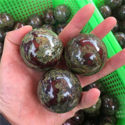 China Europe Size Dragon's Blood Spheres Crystal Stones Irregular Natural Crystal Healing Quartz Sphere Crystal Stones for sale