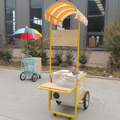 China Cooling Systems Cupcake Corn Treat Hand Pushed Food Cart With Kitchen for sale