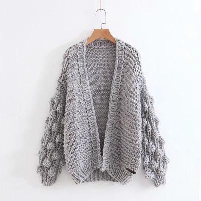 China Breathable Cavity Women Solid Knitted Cardigans Pom Pom Casual Vogue Sweaters Overcoat Long for sale