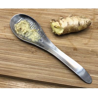 China Wholesale Stocked Multifunctional Mini Garlic Chopper Stainless Steel Squeeze Kitchen Instruments Mud Spoon Grater for sale