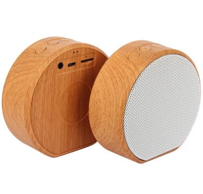 China No Creative Design Business Premium Gift Customized Logo Printing A60 Mini Portable Wood Grain Wireless Speaker for sale