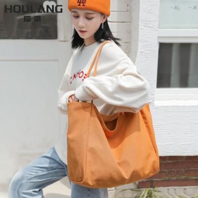 China Fashion shoulder tote large capacity craft fabric solid color canvas armpit bag simple fashion Japanese Korean women's bag all-match for sale