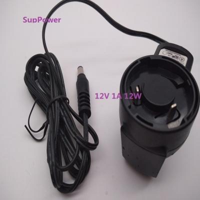 China Interchangeable Type Eu Commodities 12v 1a Electronic Multifunctional AC Plug Change Au Us British Input 100v 240v DC 50/60hz Power Adapter for sale