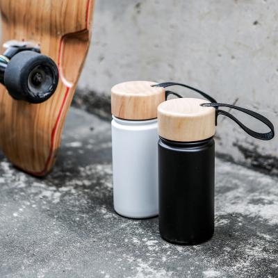 China PORTABLE Wide Mouth Wooden Lid Logo Luxury Stylish Double Wall Stainless Steel Sports Bottle Custom Insulated Bike Water Flask for sale