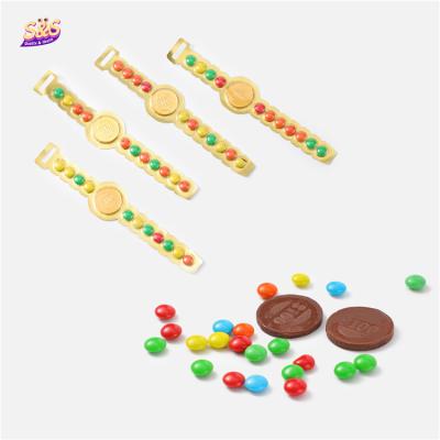 China Multicolor healthy africa halad gold watch shape crispy choco beans invent chocolate for kids for sale