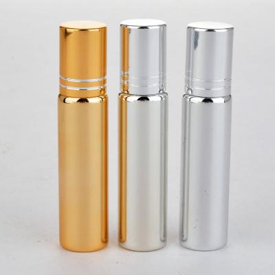 China Luxury Personal Care 5ml Yellow Gold Silver Plated Glass Roll On Bottle UV Coating Diffuser Essential Oil Bottle With Steel And Gold Ball Cap for sale