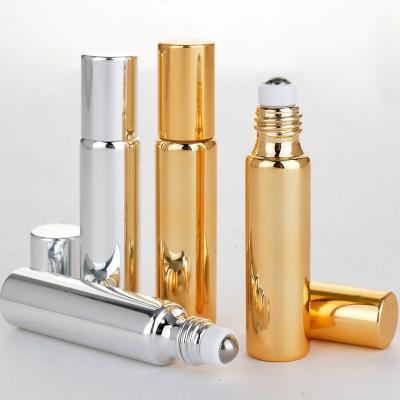 China Personal Care 5ml 10ml Shiny Gold UV Process Glass Roll On Bottle / Multi-funtion Essential Oil Perfume / Eye Cream Vials for sale