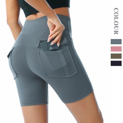 China Custom Made Antibacterial Yoga Gym Shorts Exhaust Rib Fabric Workout Tight Shorts Women Butt Lift Sports Run Yoga Shorts With Pockets for sale