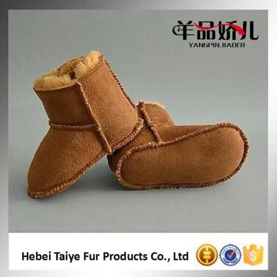 China Comfortable Wholesale Soft Fur Kid Boots Sheepskin Winter Children Shoes for sale